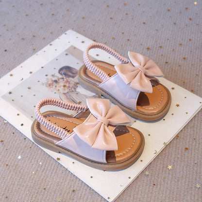Kids Sandals for Girls  Summer with  Bow Design Sandals.   Childrens Beach Shoes Open Toes,  Flat Anti-skid Rubber Ankle Strap.  Lots of stock except for size 26 in Beige, and please use the sizing chart available.
