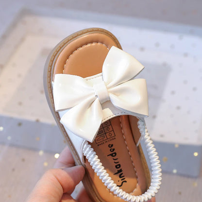 Kids Sandals for Girls  Summer with  Bow Design Sandals.   Childrens Beach Shoes Open Toes,  Flat Anti-skid Rubber Ankle Strap.  Lots of stock except for size 26 in Beige, and please use the sizing chart available.