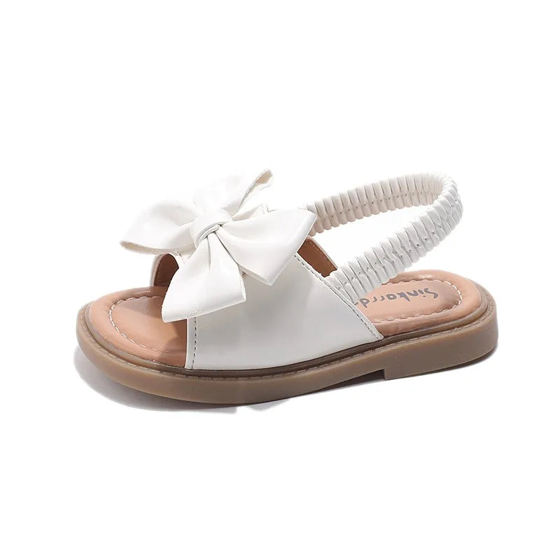 Kids Sandals for Girls  Summer with  Bow Design Sandals.   Childrens Beach Shoes Open Toes,  Flat Anti-skid Rubber Ankle Strap.  Lots of stock except for size 26 in Beige, and please use the sizing chart available.